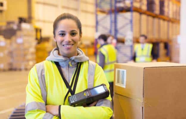 Warehouse workers using barcode scanners in a manufacturing environment