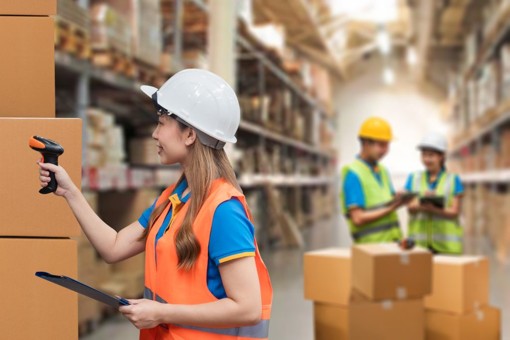 Manufacturing team managing automated inventory operations